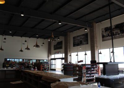 interior store with high ceiling and brick accents