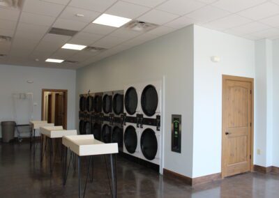 multiple washing machines recessed in the walls