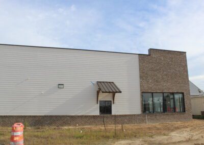 exterior siding with brick accents